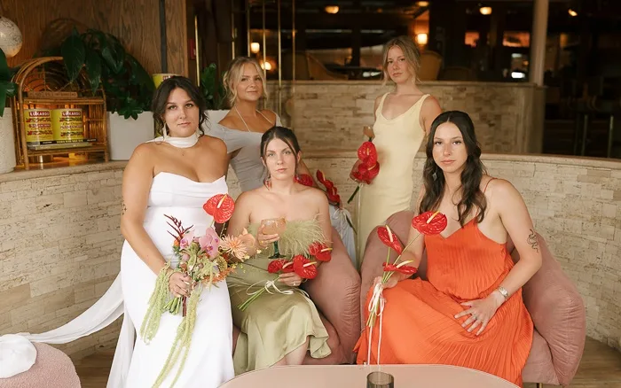 Bridesmaids with anthuriums